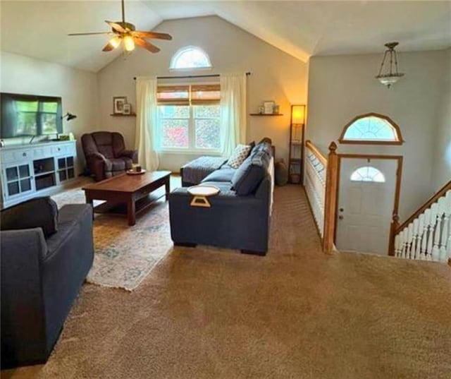 1720 SE Kenwood Dr, Blue Springs, MO 64014 - carpeted living room with ceiling fan, vaulted ceiling, and plenty of natural light