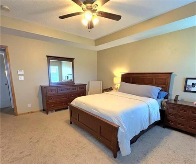 1720 SE Kenwood Dr, Blue Springs, MO 64014 - bedroom with light colored carpet and a ceiling fan