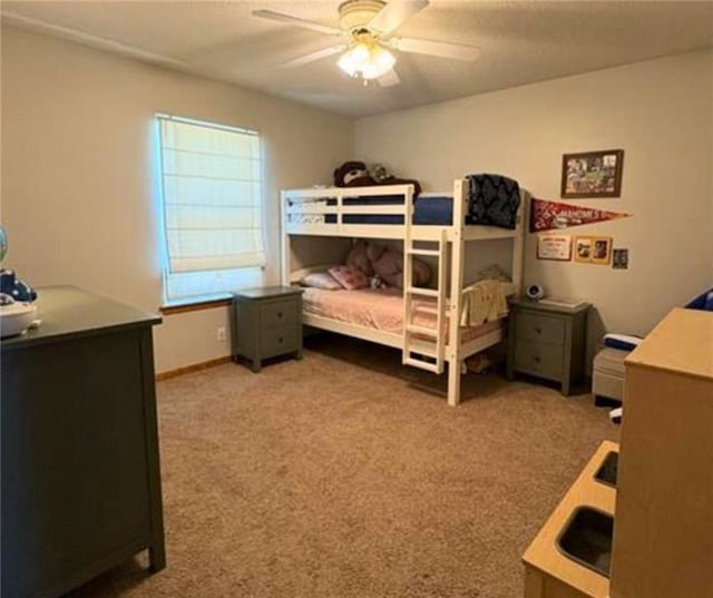 1720 SE Kenwood Dr, Blue Springs, MO 64014 - bedroom featuring carpet flooring, a desk, and a ceiling fan