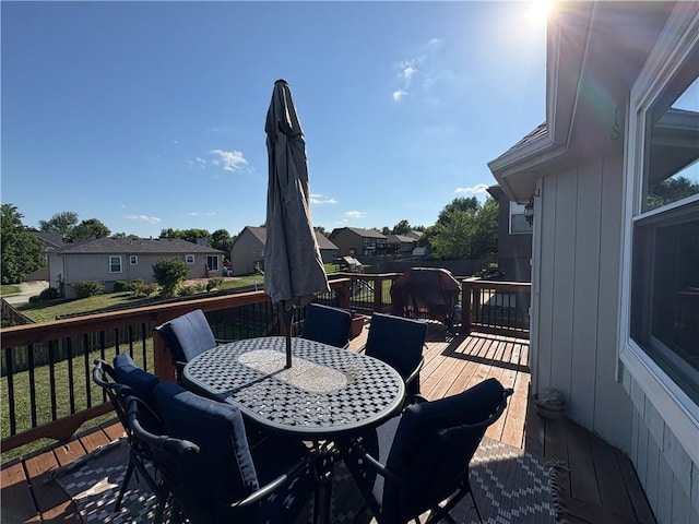 1720 SE Kenwood Dr, Blue Springs, MO 64014 - deck with outdoor dining space and a residential view