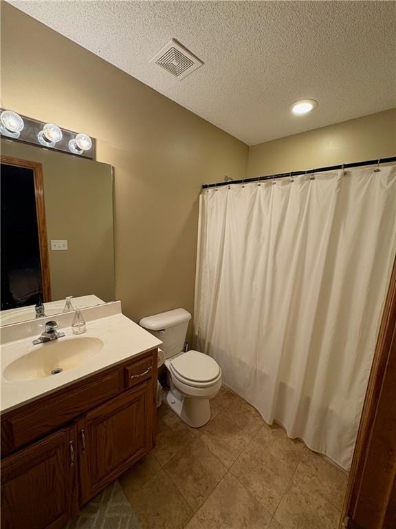 1720 SE Kenwood Dr, Blue Springs, MO 64014 - full bathroom with a textured ceiling, vanity, tile patterned flooring, and curtained shower