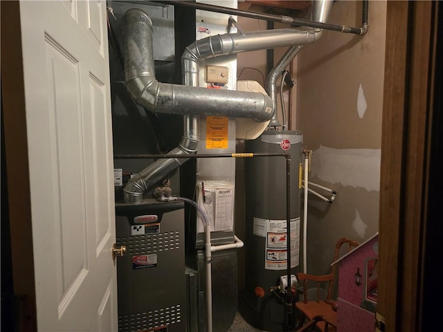 1720 SE Kenwood Dr, Blue Springs, MO 64014 - utility room featuring water heater and heating unit