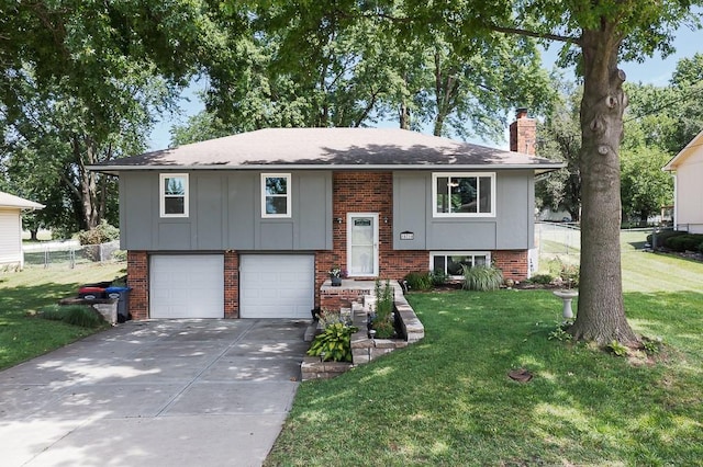 15714 Leavenworth Rd, Basehor, KS 66007 - raised ranch featuring a chimney, brick siding, concrete driveway, an attached garage, and board and batten siding