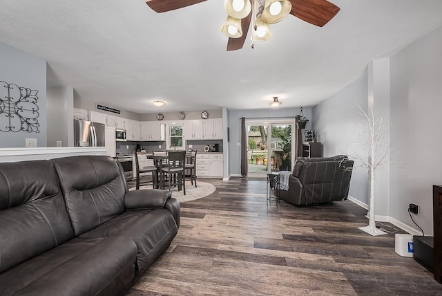 15714 Leavenworth Rd, Basehor, KS 66007 - living room featuring dark wood-style floors and a ceiling fan