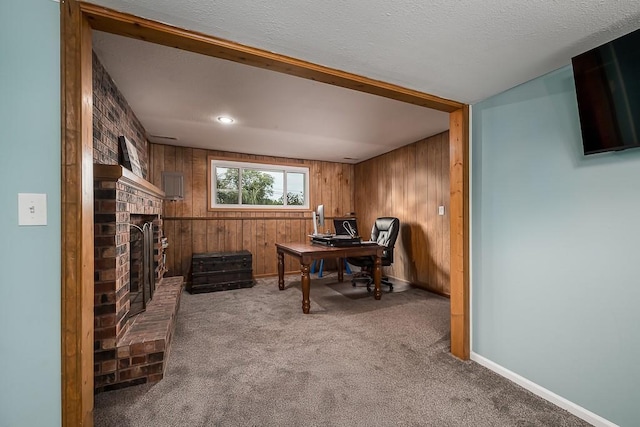 15714 Leavenworth Rd, Basehor, KS 66007 - carpeted office featuring wood walls, a brick fireplace, and a textured ceiling