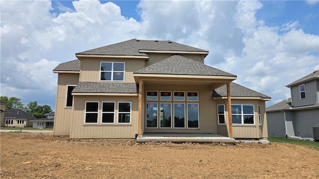 12301 W 184th St, Overland Park, KS 66013 - back of property with a shingled roof and a patio