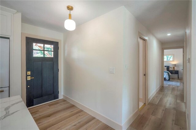 9730 State Line Rd, Leawood, KS 66206 - foyer with light wood-style floors, healthy amount of natural light, and recessed lighting