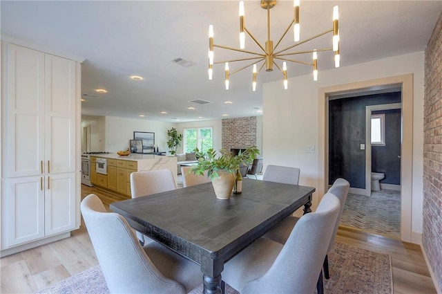 9730 State Line Rd, Leawood, KS 66206 - dining room with light wood finished floors and a chandelier