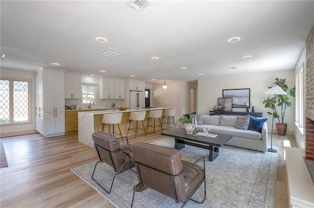 9730 State Line Rd, Leawood, KS 66206 - living area featuring light wood-type flooring and recessed lighting