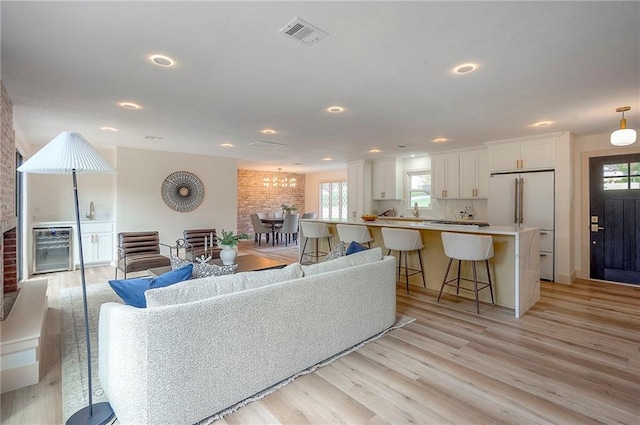 9730 State Line Rd, Leawood, KS 66206 - living room with light wood-style flooring and recessed lighting