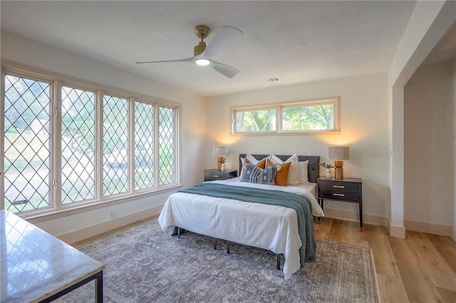 9730 State Line Rd, Leawood, KS 66206 - bedroom with light wood finished floors and a ceiling fan