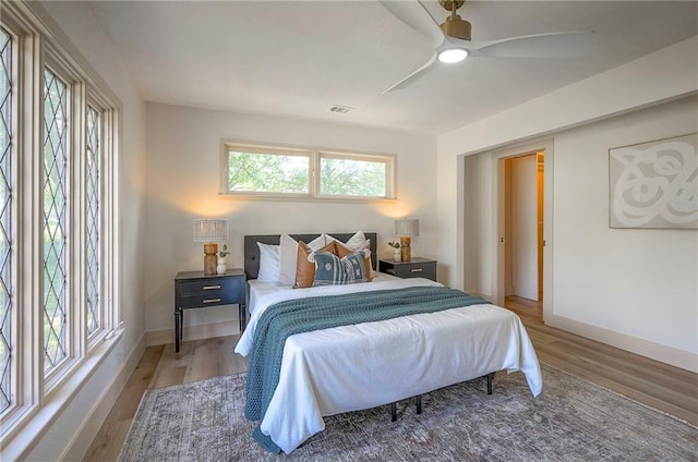 9730 State Line Rd, Leawood, KS 66206 - bedroom featuring wood finished floors and ceiling fan