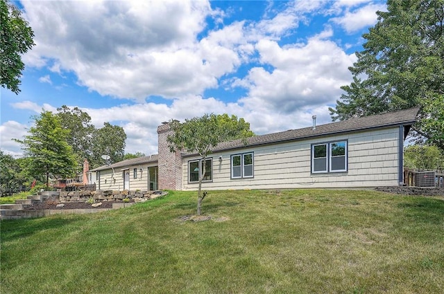 9730 State Line Rd, Leawood, KS 66206 - rear view of property featuring a yard and a chimney