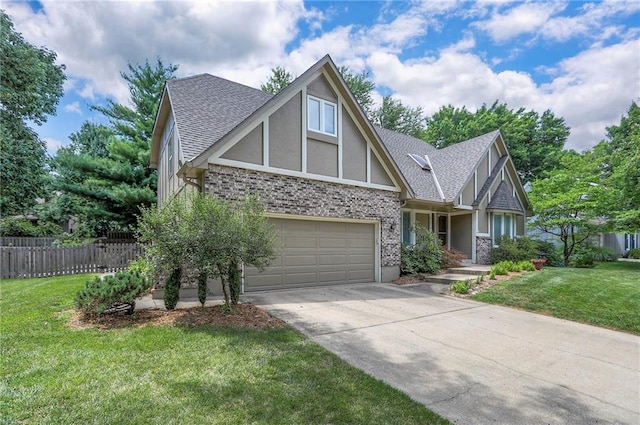 11512 Hadley St, Overland Park, KS 66210 - tudor house featuring stucco siding, driveway, roof with shingles, a garage, and brick siding