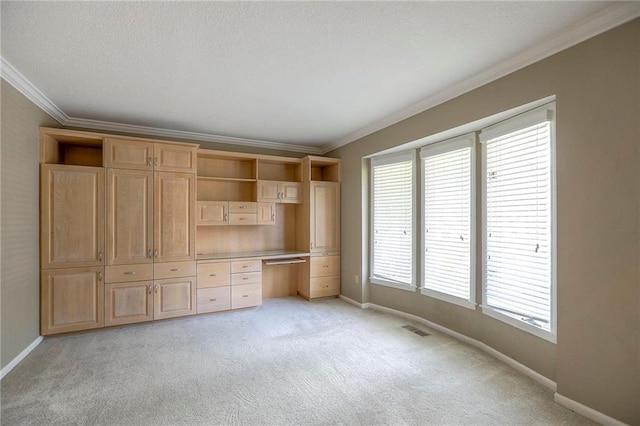 11512 Hadley St, Overland Park, KS 66210 - unfurnished bedroom featuring built in study area, ornamental molding, and light colored carpet