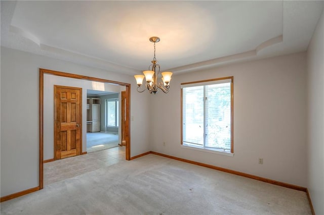 11512 Hadley St, Overland Park, KS 66210 - unfurnished room with light carpet and a chandelier
