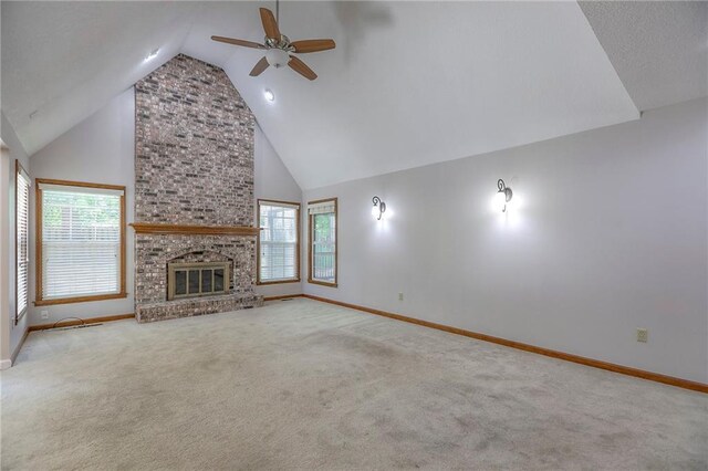 11512 Hadley St, Overland Park, KS 66210 - unfurnished living room with a ceiling fan, carpet floors, high vaulted ceiling, and a fireplace