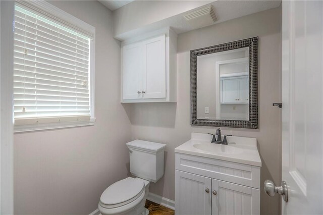 11512 Hadley St, Overland Park, KS 66210 - half bathroom with vanity and healthy amount of natural light