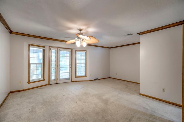 11512 Hadley St, Overland Park, KS 66210 - spare room featuring crown molding, a ceiling fan, healthy amount of natural light, and carpet