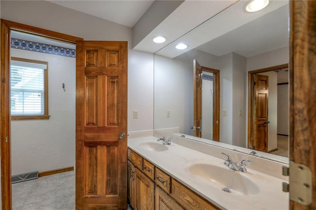 11512 Hadley St, Overland Park, KS 66210 - bathroom featuring double vanity and recessed lighting