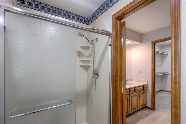 11512 Hadley St, Overland Park, KS 66210 - bathroom with a stall shower, vanity, and a spacious closet