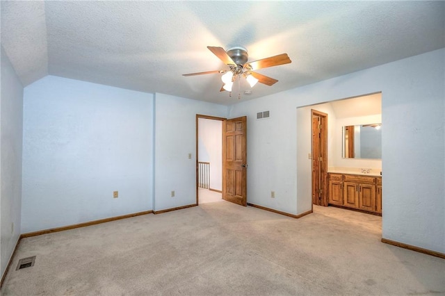 11512 Hadley St, Overland Park, KS 66210 - unfurnished bedroom with light colored carpet, ensuite bath, and a ceiling fan