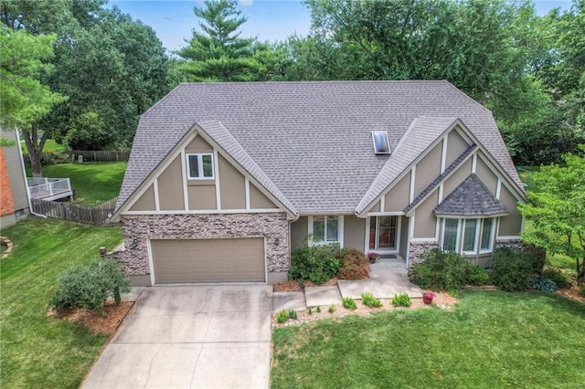 11512 Hadley St, Overland Park, KS 66210 - tudor house featuring stucco siding, concrete driveway, a shingled roof, and a garage