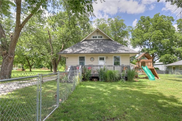 2509 E 4th St, Pittsburg, KS 66762 - view of front of house with a playground and a shingled roof
