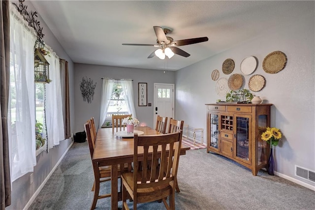 2509 E 4th St, Pittsburg, KS 66762 - carpeted dining area with a ceiling fan and baseboards