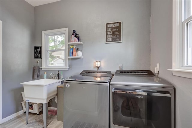 2509 E 4th St, Pittsburg, KS 66762 - washroom with independent washer and dryer and light wood-style flooring