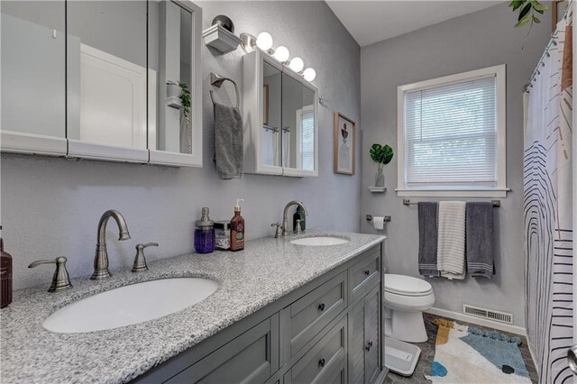 2509 E 4th St, Pittsburg, KS 66762 - bathroom featuring double vanity and curtained shower