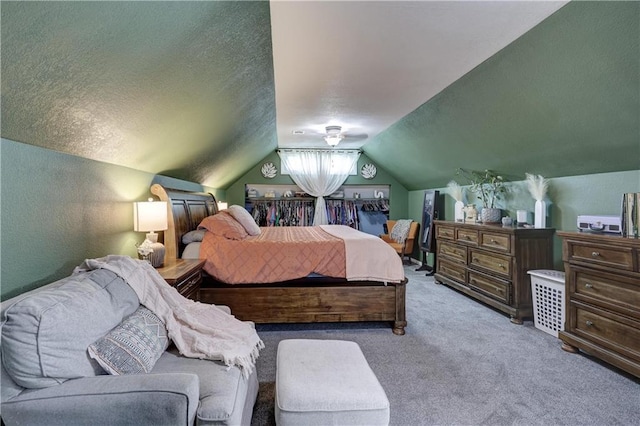 2509 E 4th St, Pittsburg, KS 66762 - bedroom with carpet flooring, vaulted ceiling, and a textured ceiling