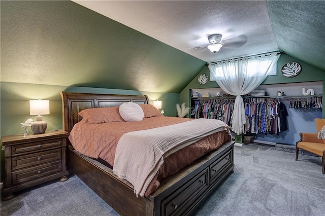 2509 E 4th St, Pittsburg, KS 66762 - bedroom featuring carpet floors, a textured ceiling, vaulted ceiling, and a ceiling fan