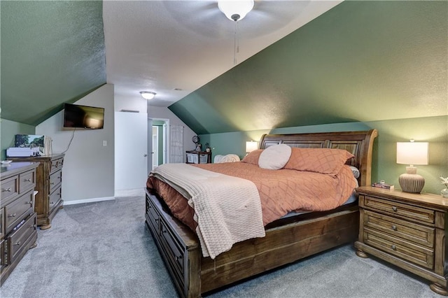 2509 E 4th St, Pittsburg, KS 66762 - carpeted bedroom featuring lofted ceiling, a textured ceiling, and ceiling fan