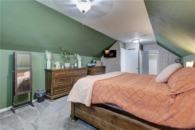 2509 E 4th St, Pittsburg, KS 66762 - carpeted bedroom with vaulted ceiling, a ceiling fan, and a textured ceiling