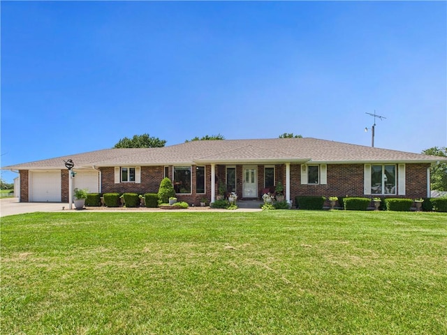 529 SE Dd Hwy, Warrensburg, MO 64093 - ranch-style home with an attached garage, a front lawn, driveway, and brick siding