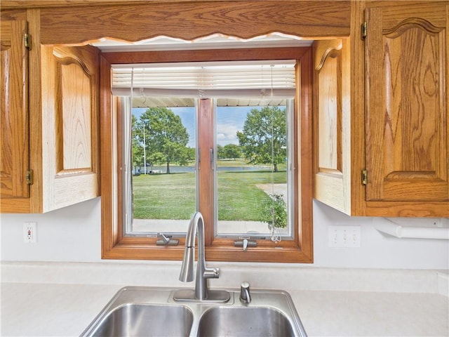 529 SE Dd Hwy, Warrensburg, MO 64093 - kitchen with light countertops and brown cabinetry