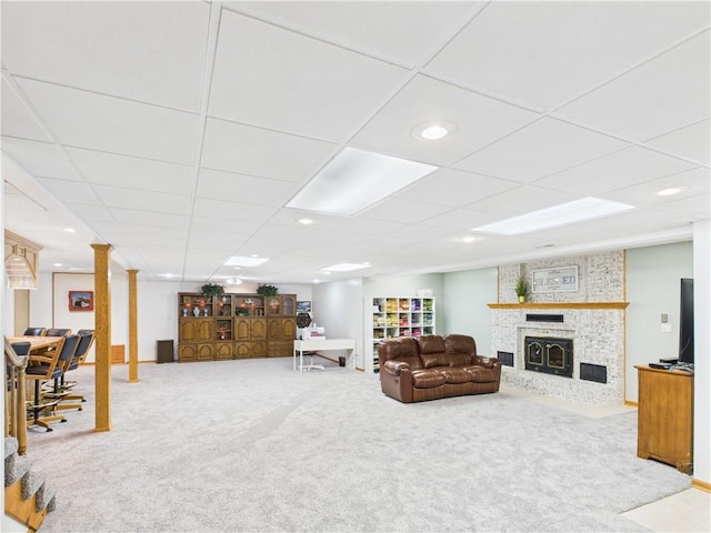 529 SE Dd Hwy, Warrensburg, MO 64093 - carpeted living area with a large fireplace, a drop ceiling, and recessed lighting