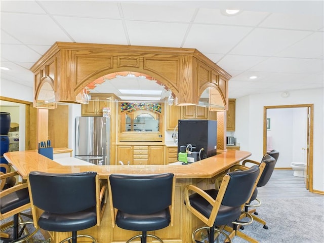529 SE Dd Hwy, Warrensburg, MO 64093 - bar with freestanding refrigerator, a drop ceiling, recessed lighting, and fridge
