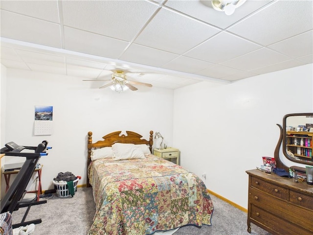529 SE Dd Hwy, Warrensburg, MO 64093 - bedroom featuring carpet flooring, a paneled ceiling, and a ceiling fan