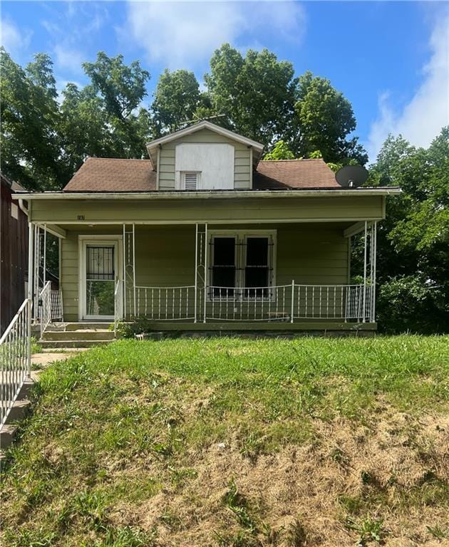 707 Georgia Ave, Kansas City, KS 66101 - view of front of house featuring a porch