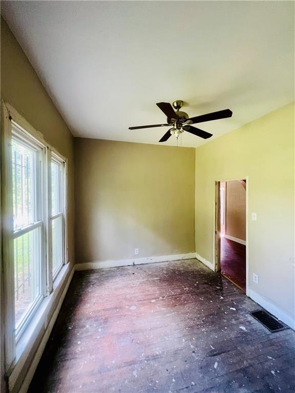 707 Georgia Ave, Kansas City, KS 66101 - spare room with baseboards and a ceiling fan