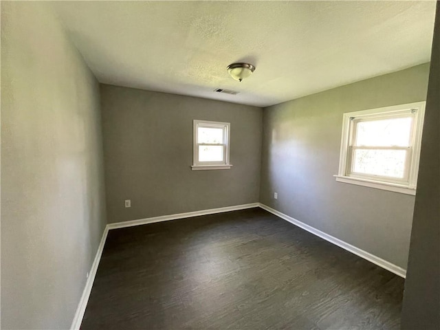 13508 E Silver Ln, Independence, MO 64050 - unfurnished room featuring dark wood-style floors and baseboards