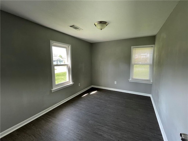 13508 E Silver Ln, Independence, MO 64050 - unfurnished room with dark wood-style floors and baseboards