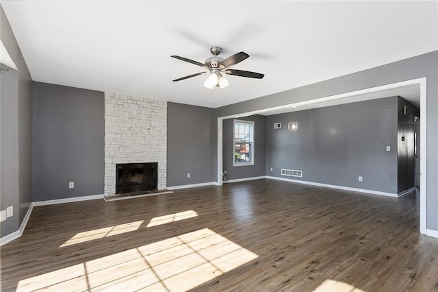 14011 Dunbar Ct, Grandview, MO 64030 - unfurnished living room featuring a ceiling fan, a fireplace, and wood finished floors