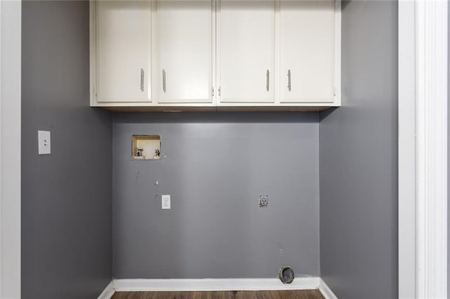 14011 Dunbar Ct, Grandview, MO 64030 - laundry area featuring hookup for an electric dryer, hookup for a washing machine, cabinet space, and wood finished floors