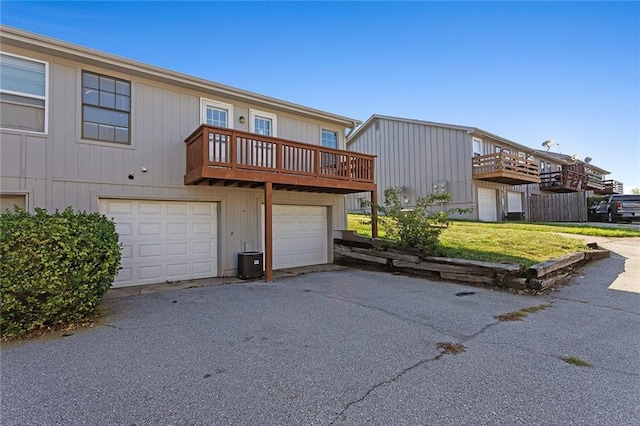 14011 Dunbar Ct, Grandview, MO 64030 - view of front facade featuring an attached garage, driveway, and a front lawn