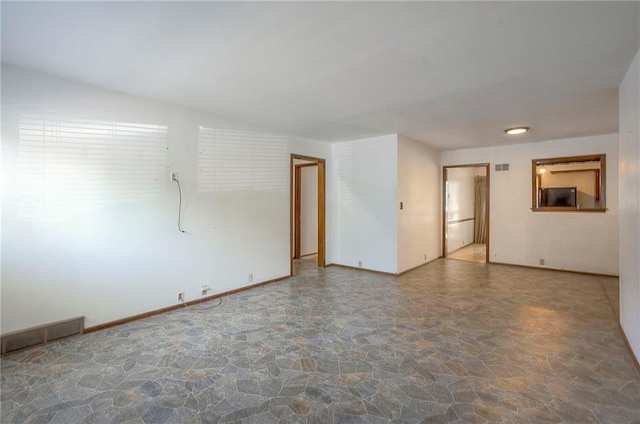 462 W 104th St Unit A, Kansas City, MO 64114 - spare room with stone floors and baseboards