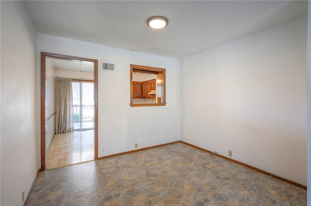 462 W 104th St Unit A, Kansas City, MO 64114 - spare room featuring stone flooring and baseboards