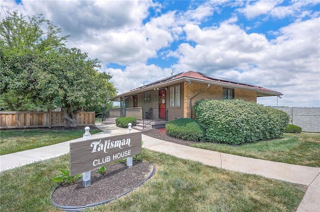 462 W 104th St Unit A, Kansas City, MO 64114 - view of front of house featuring brick siding, solar panels, and covered porch
